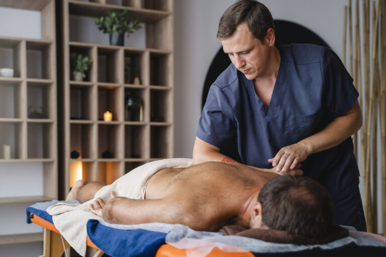 side-view-man-getting-professional-massage - Hope Wellness