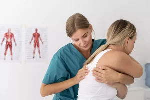 Registered massage therapist performing therapeutic massage to relieve muscle tension in Milton.
