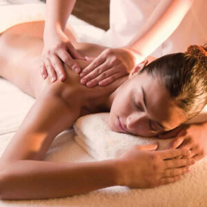 A client experiencing a Relaxation Massage Milton at Hope Wellness to relieve stress and shoulder tension.